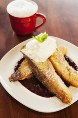 vanilla-dipped French toast, whipped cream and syrup with coffee