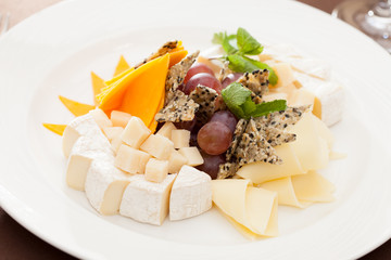 Cheese plate with grapes