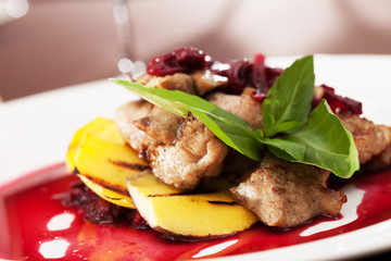 meat with mango and cherry sauce