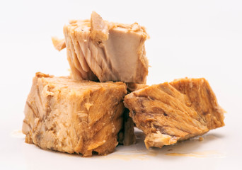 marinated chunks of tuna isolated on white