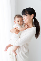 asian baby and mother relaxing
