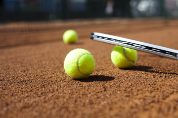 Tennis racket and balls, court