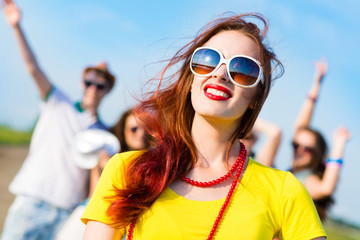 stylish young woman in sunglasses