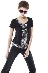 Portrait of fashion young woman wearing sunglasses standing