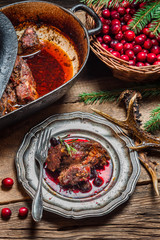 Freshly roasted venison with cranberry sauce and rosemary