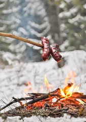 Foto op Plexiglas Sausages and winter campfire © Mangojuicy