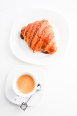 croissant and coffee cup