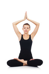 Woman in lotus pose on white