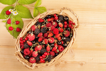 Ripe Berries on Wooden Background