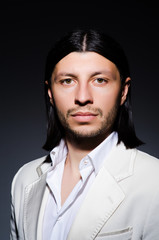 Handsome man against the dark background