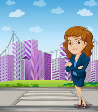 A businesswoman with a formal attire standing at the pedestrian