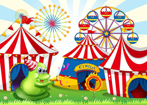 A carnival with a green three-eyed monster