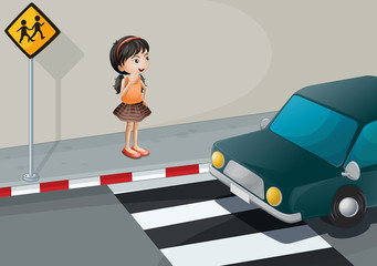 A little girl at the pedestrian lane