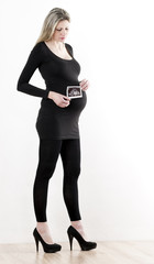 Fototapeta premium pregnant woman with a sonogram of her baby