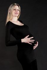 portrait of pregnant woman wearing black clothes