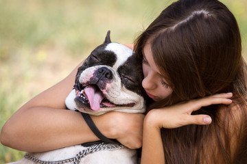 Giving her puppy a hug