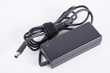 Laptop AC adapter on white