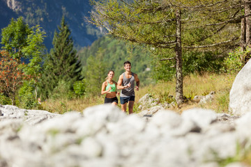 Young sporty couple is doing running exercises