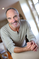 Fototapeta premium Portrait of handsome mature man at home