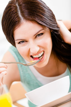 Girl eating healthy breakfast