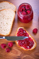 Rapsberry jam with slice of bread