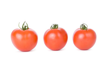 Ripe tomatoes isolated on a white background