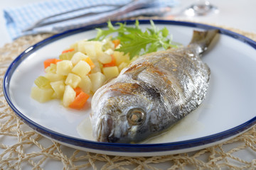 Baked sea bream with vegetables
