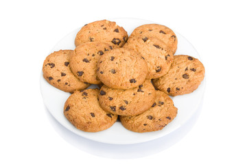 Pile of chocolate chip cookies ona dish isolated