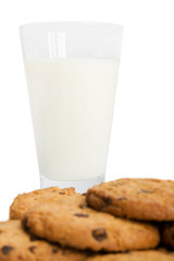 Chocolate chip cookies and a glass of milk isolated on white.