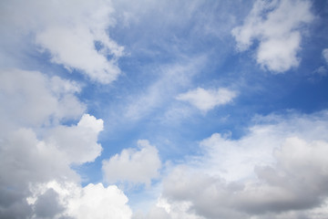 White bold clouds over a blue sunny sky