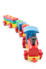 Fototapeta premium Toy wooden train isolated on white