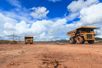 big truck in open pit and blue sky