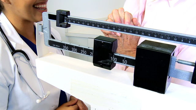 Retired Caucasian Female Clinic Weigh Scales