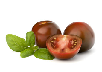 Tomato kumato and basil leaf