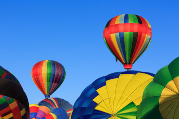 hot air balloons against blue sky