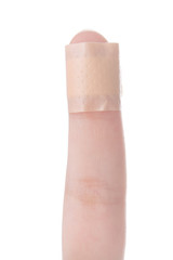 Hurt finger with a bandage isolated on white.