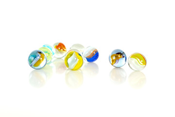 Colourful marbles on white background