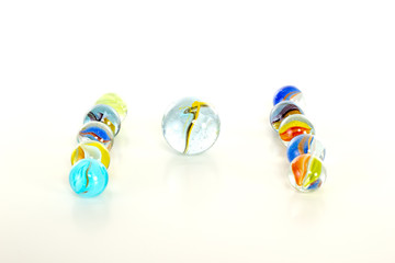 Colourful marbles on white background