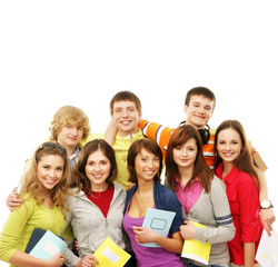 A group of happy teenagers posing together with books