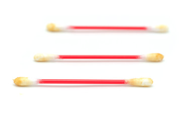 dirty ear sticks on a white background