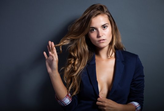 Sexy woman without bra in jacket