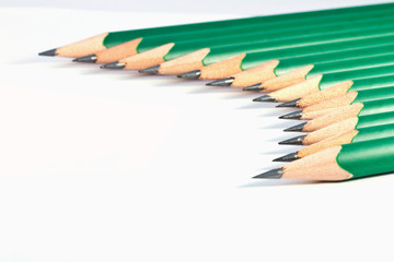 Obraz premium lower view of green pencils on white background