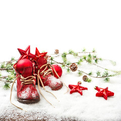 christmas decoration red balls, stars and antique baby shoes