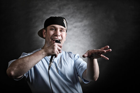 Rap singer man with microphone cool hand gesture