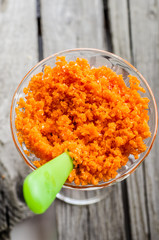 Grated carrots in a glass
