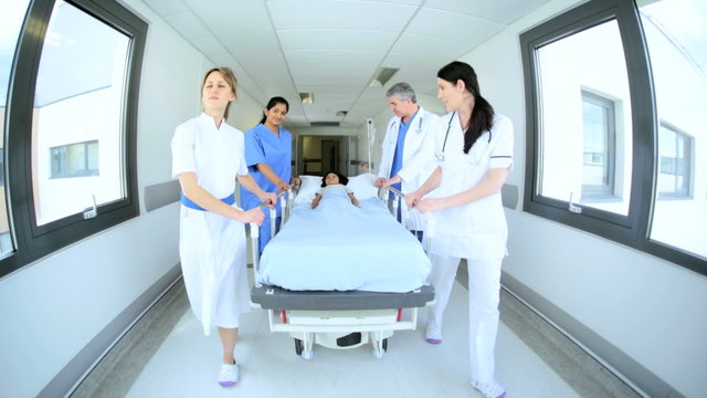 Hospital Staff Pushing Bed Young Patient Medical Facility