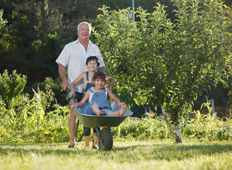 grandfather rolls the children