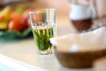 Cup of hot drink set on table