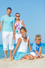 Fototapeta premium Family having fun on beach