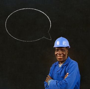 African Black Worker With Chalk Speech Bubble On A Background